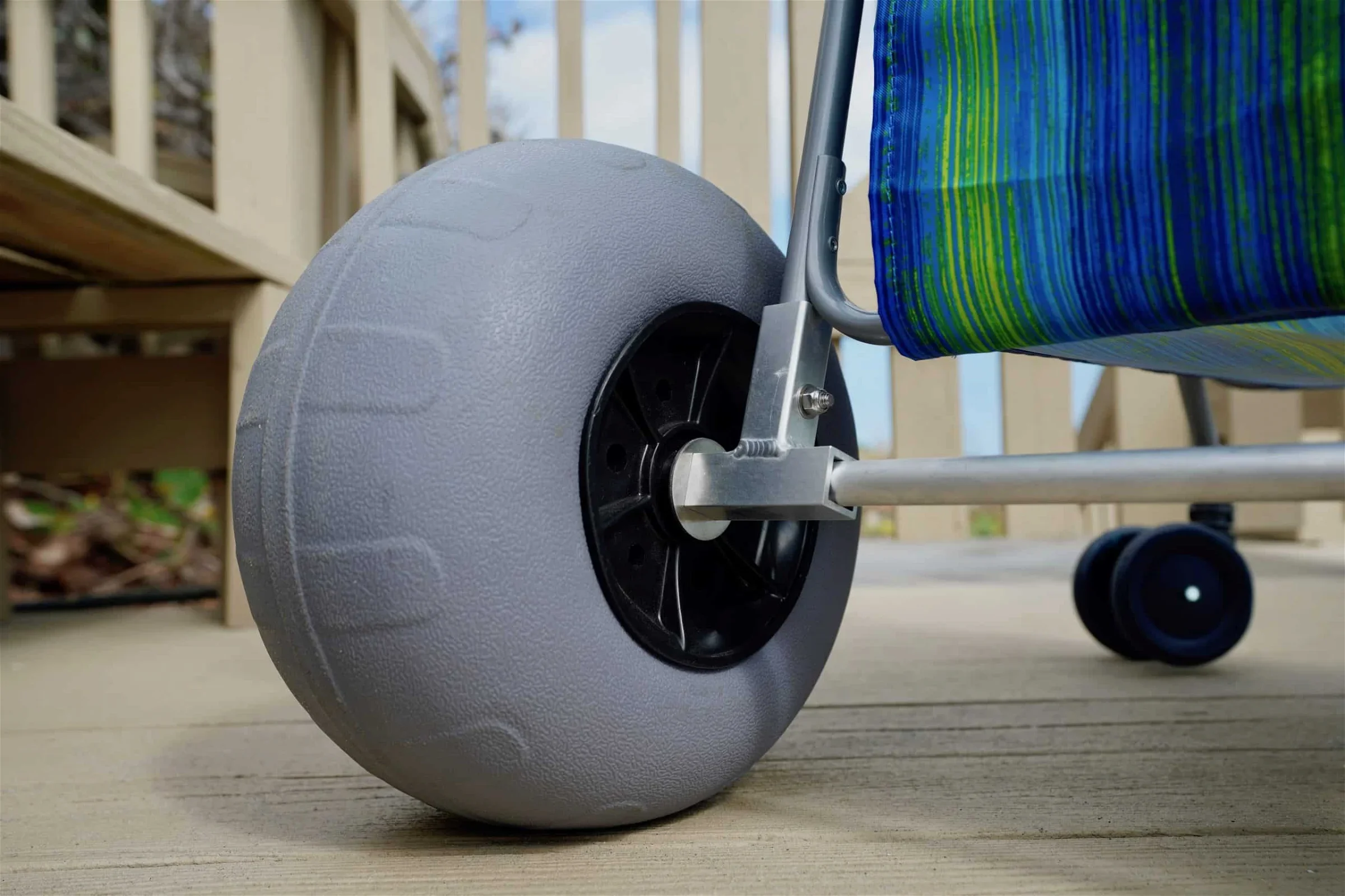 A close up view of a beach balloon tire on a cart.
