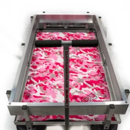 pink, white, and grey camo patterned neoprene deck mat inside aluminum wagon